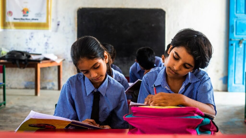 Two girls studying together at a desk