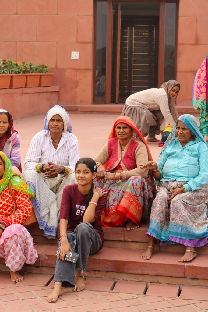 Women sitting together on the steps of a building